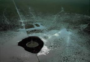 Pampa . Una pozza per l'abbeveraggio del bestiame nelle pianure della Pampa Umida.De Agostini Picture Library/Pubbli Aer Foto