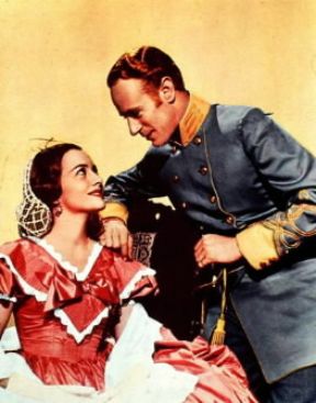 Leslie Howard con Olivia de Havilland in Via col vento (1939).De Agostini Picture Library